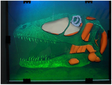 a hologram of a t-rex skull overlayed with computer graphics
